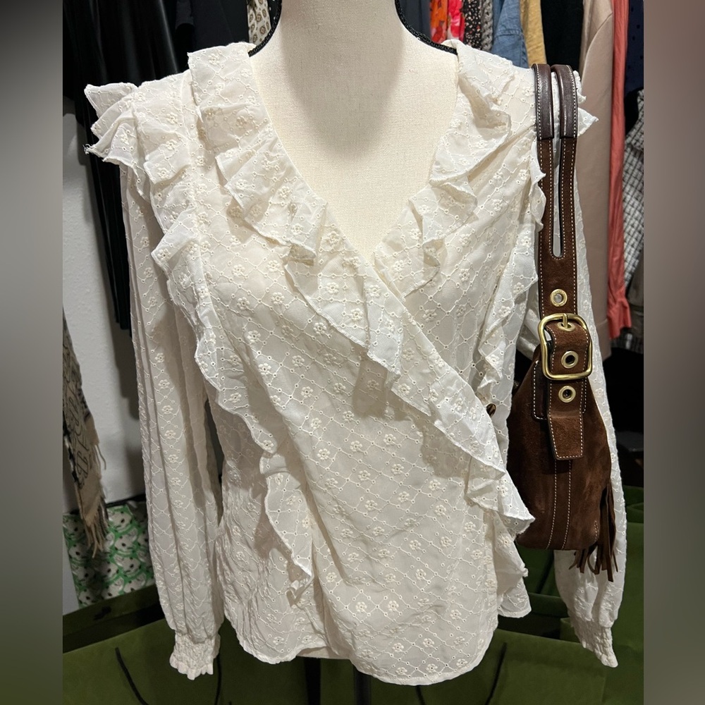 Anthropology ruffled blouse, color is ivory and size 12. Gently worn!